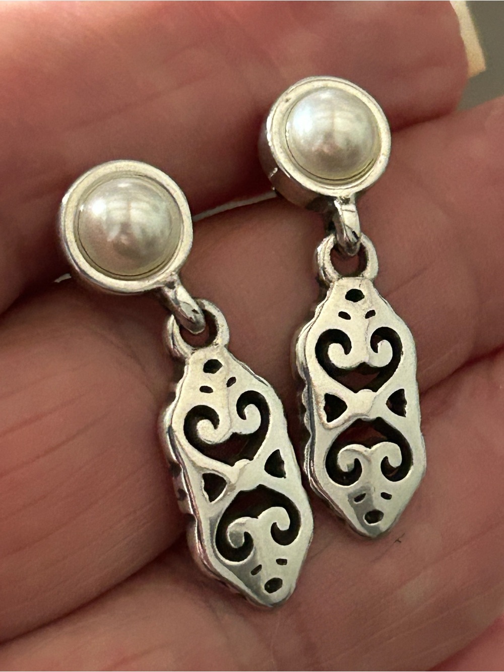 Brighton silver plated and pearl earrings feature filigree dangle charms